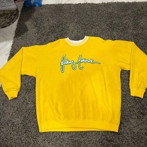 Really bright yellow sweater that has never been worn. Size is large.